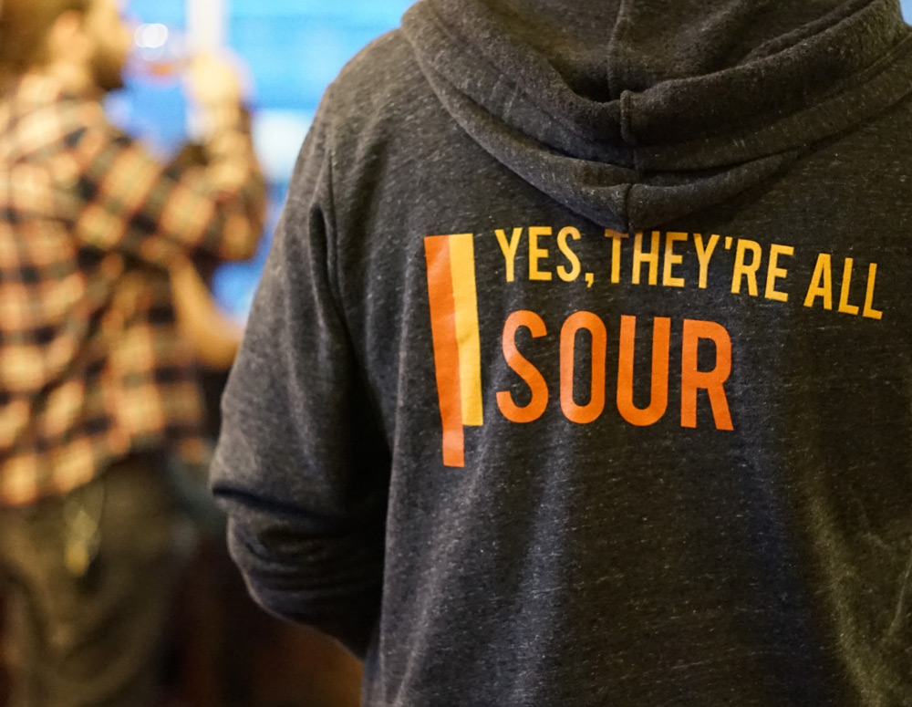 Jacket that says "Yes, they're all sour"