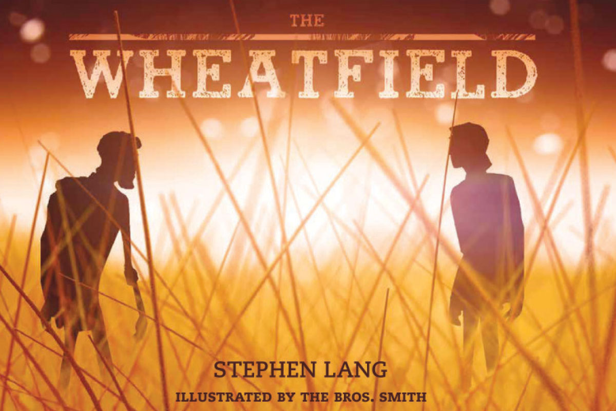 The cover of “The Wheatfield”: The illustrated silhouettes of two men in a field of wheat, drawn in a brown color palette