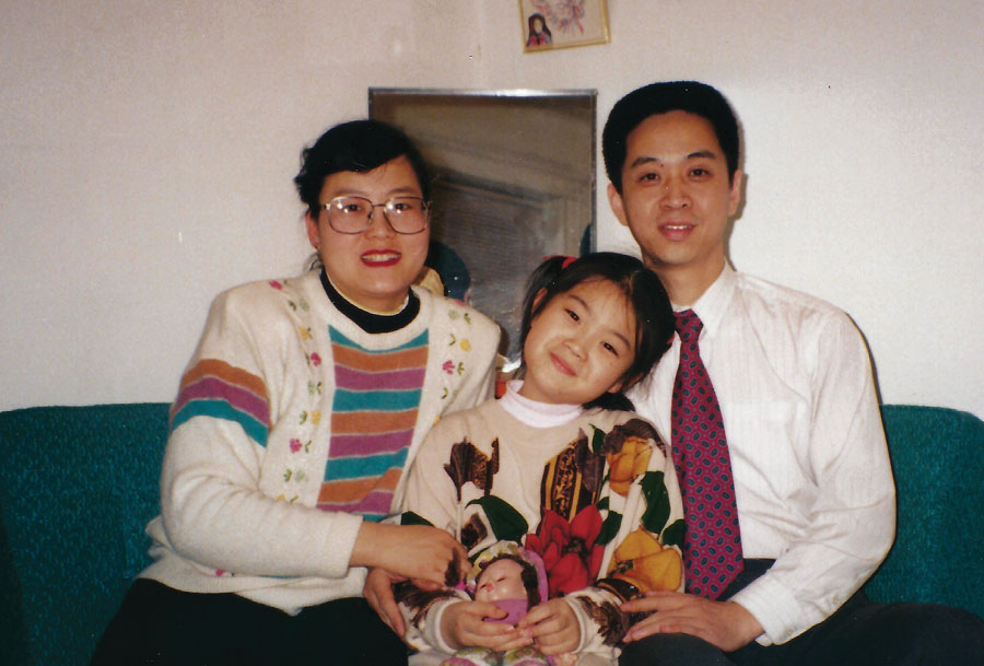 Old snapshot of Qian Julie Wang and two family members