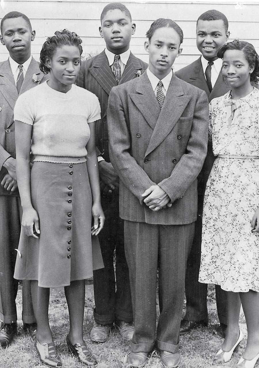 Vintage photo of six Black college students. Sandra Alexander’s mother, Marie, is to the right in a floral dress.