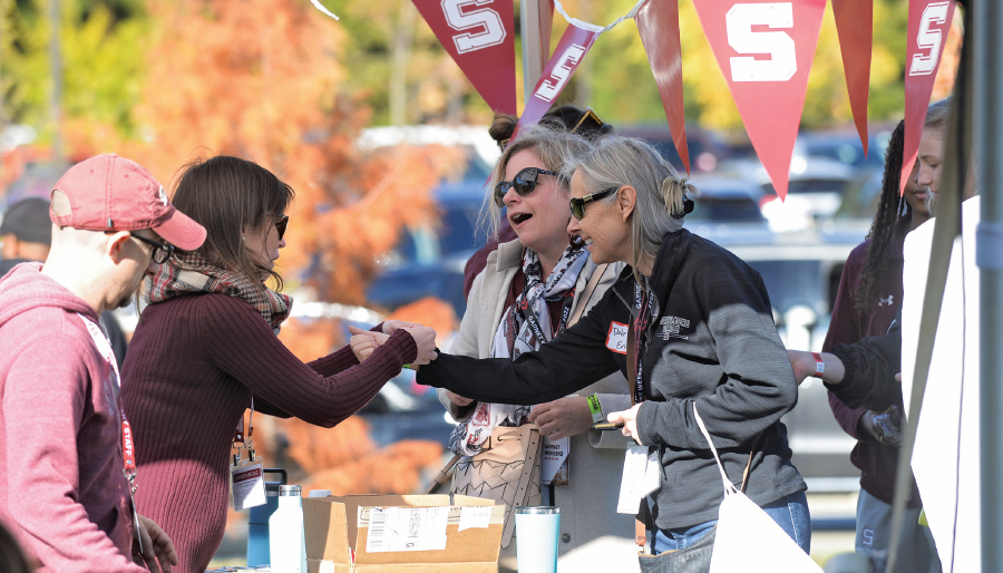 Staff welcome alumnae back to campus