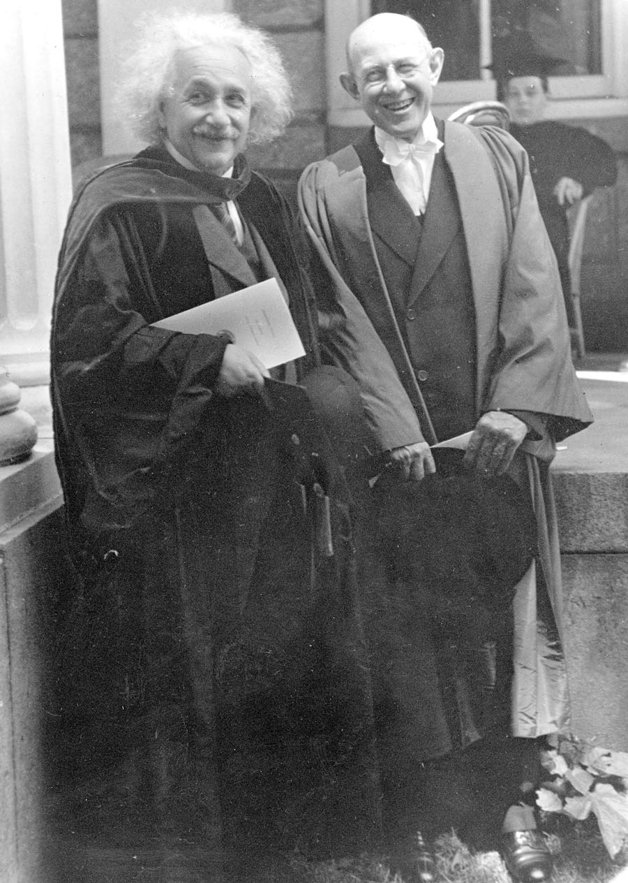 Black and white photo of Albert Einstein (left) and Frank Ayedelotte (right) in graduation robes