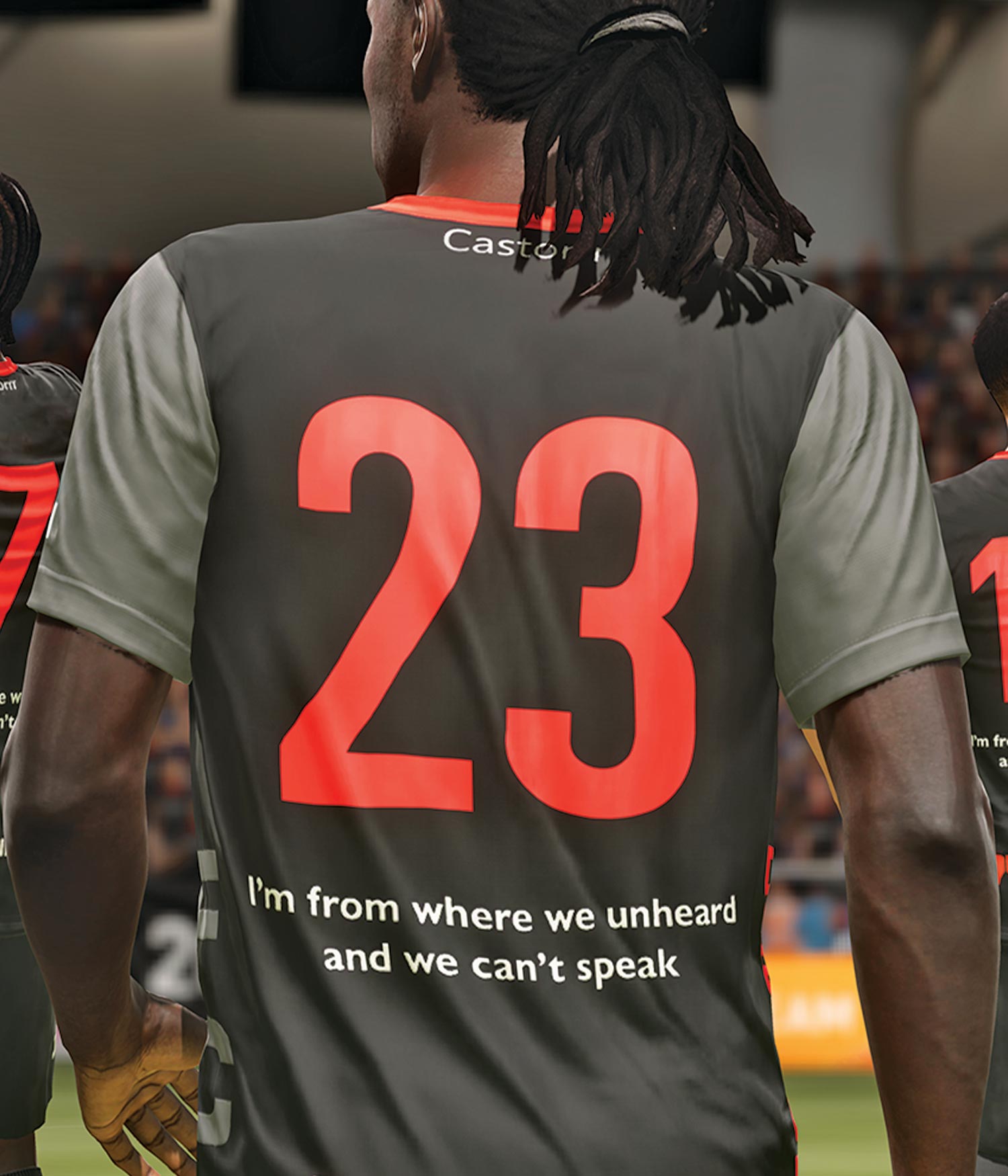 This red, black, and gray student-designed jersey features the red number "23" in large font and the message "I'm from where we unheard and we can't speak" in smaller, white font.