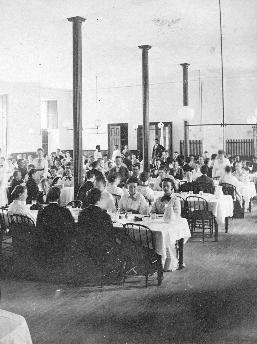 old black and white photograph of students eating in the old Swarthmore dining hall