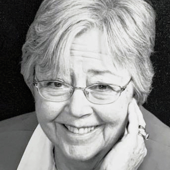 Catherine “Cay” Hall Roberts ’63 is smiling in this black and white photo.