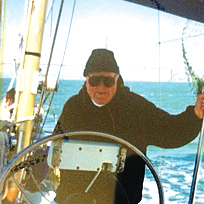 David H. Schoenbrod '52 steering his boat.