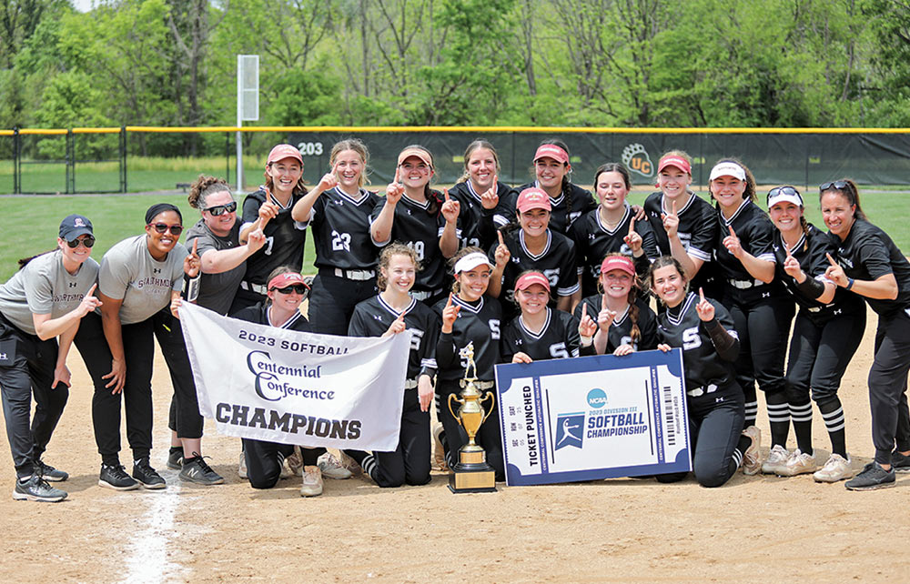 The women's softball team celebrates Centennial Conference Championship on the mound.