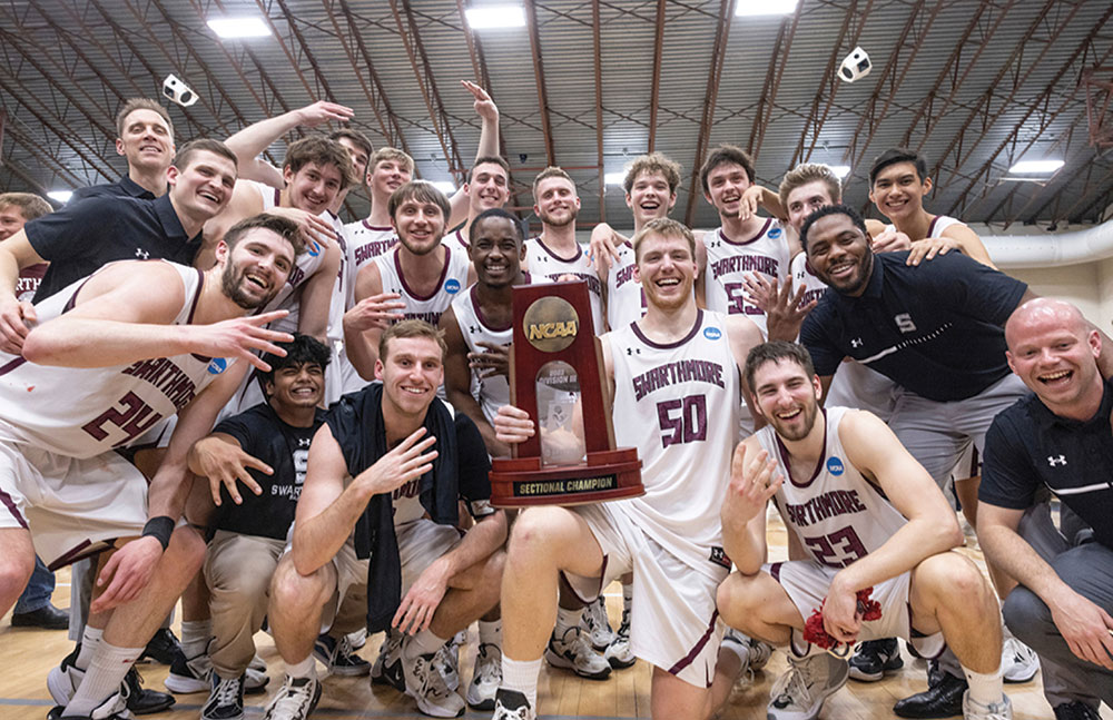 The men's basketball team celebrates with trophy and smiles as they made it to the Final Four.