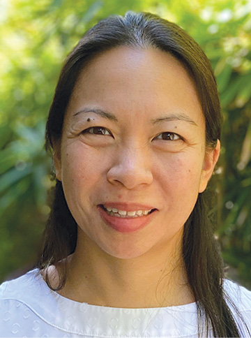 Jane Liu '99 smiles wearing white shirt 