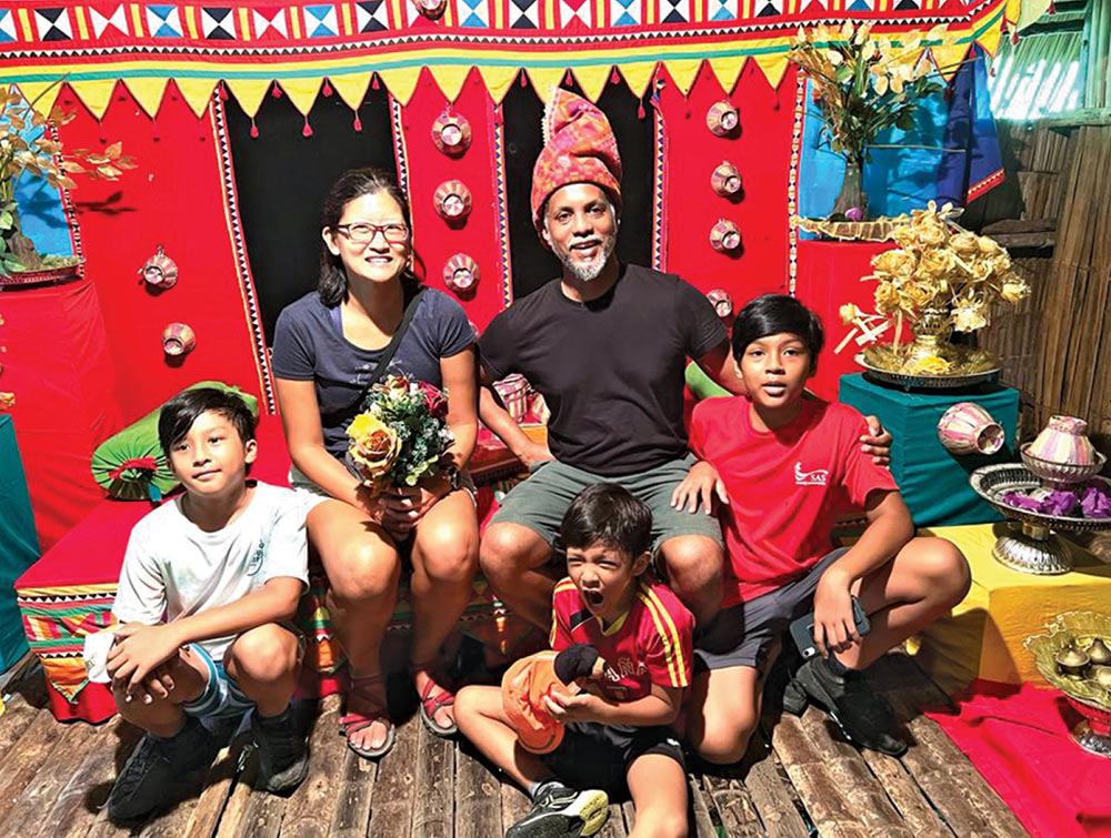 Kulasooriya family on vacation in Borneo. With red background