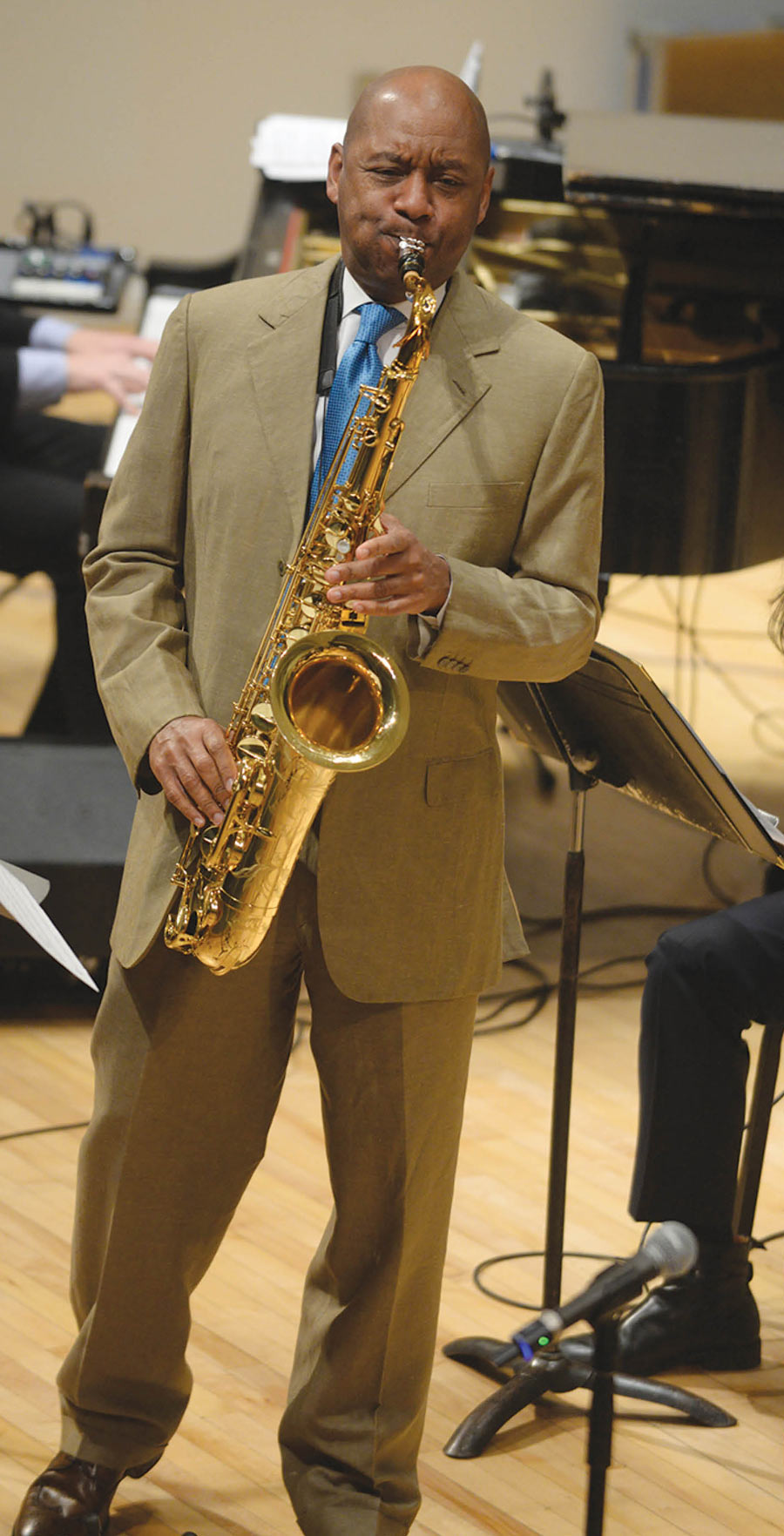 Branford Marsalis playing the saxophone on stage