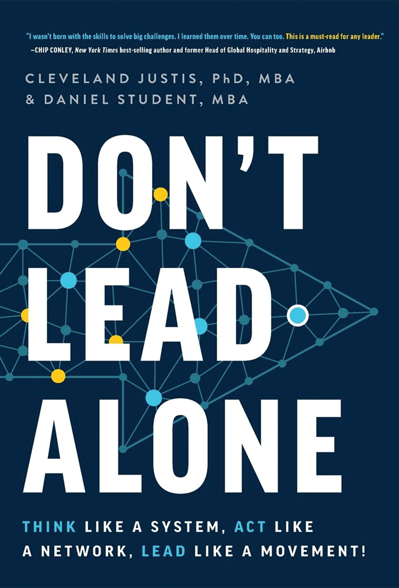 The cover of Don't Lead Alone is navy blue with white text and a light blue arrow pointing towards the right.