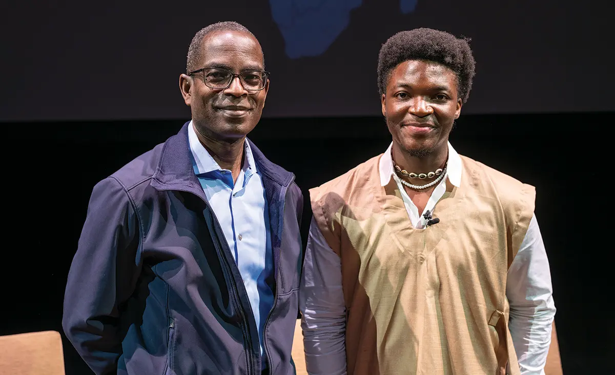 Alum Patrick G. Awuah of Ghana and current student Steven Tuti Mukum of Cameroon stand side by side at the Africa is Rising Symposium, which Mukum organized.