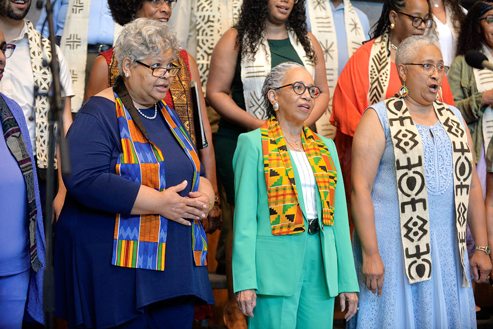 Cynthia Hunter Spann '75, Gina Hardy Harris '78, and Bernita Taylor '80 stand and sing.