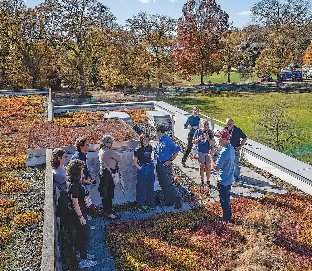 Alums enjoy views of campus from the roof of David Kemp Hall.