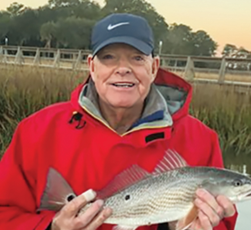 David A. Goslin holds a fish he caught