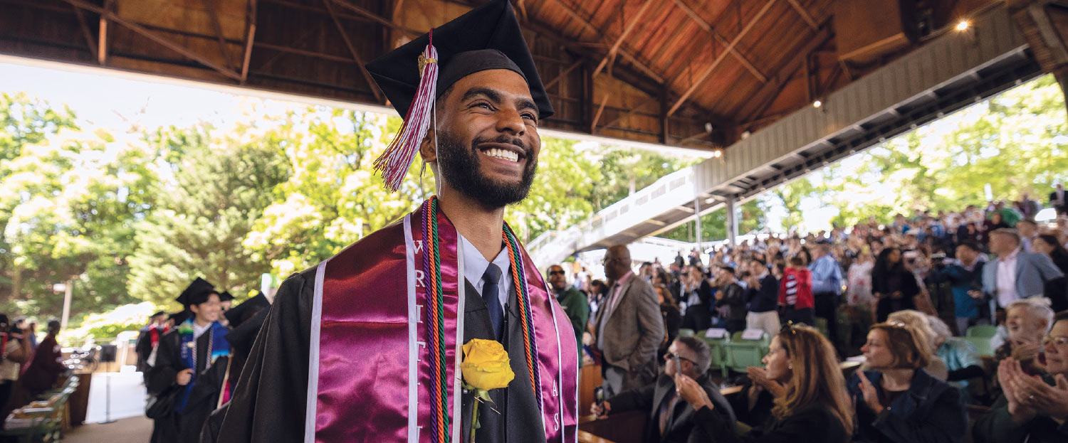 Graduating senior Brandon Archer smiles as he crosses the stage to receive his diploma.
