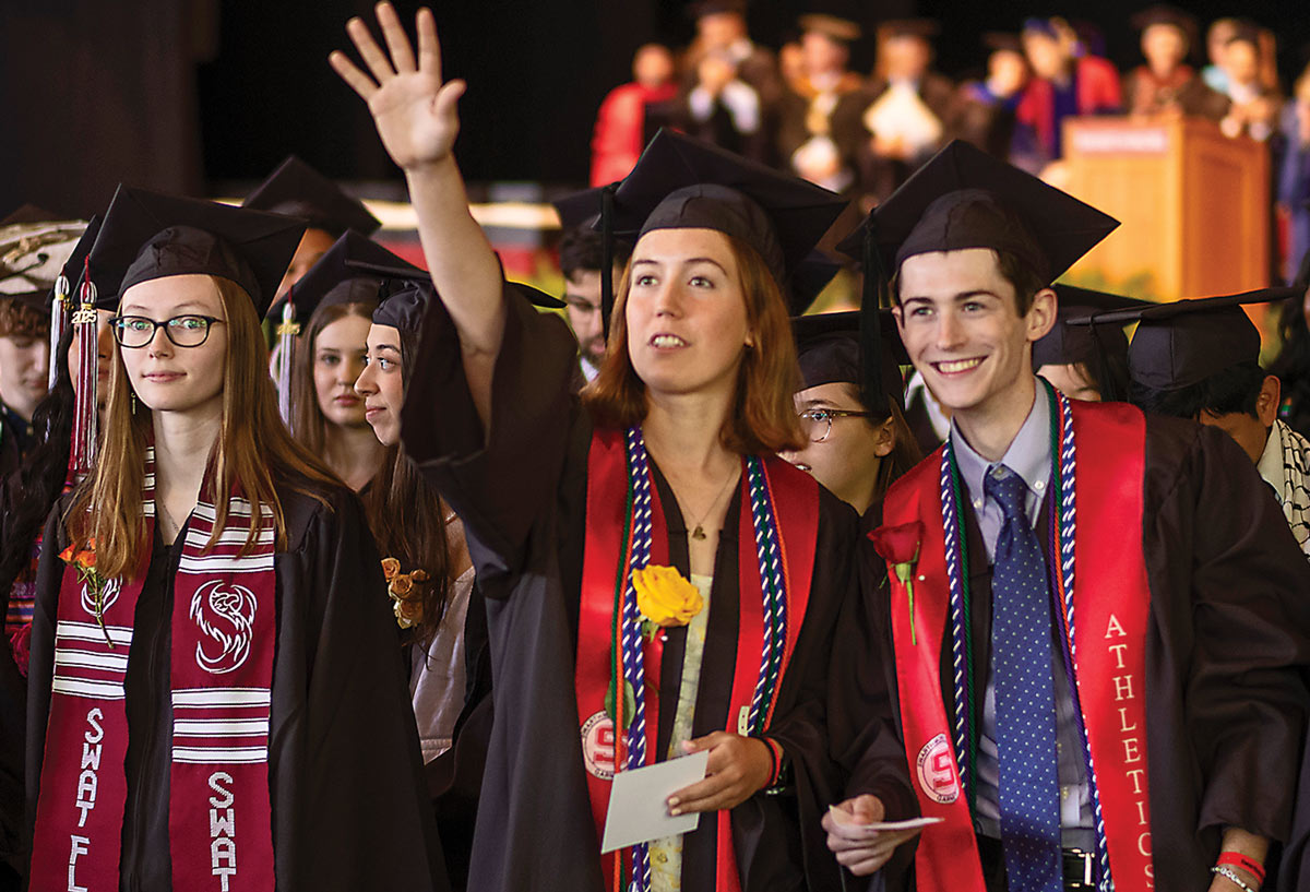 Students line up to receive their diplomas.