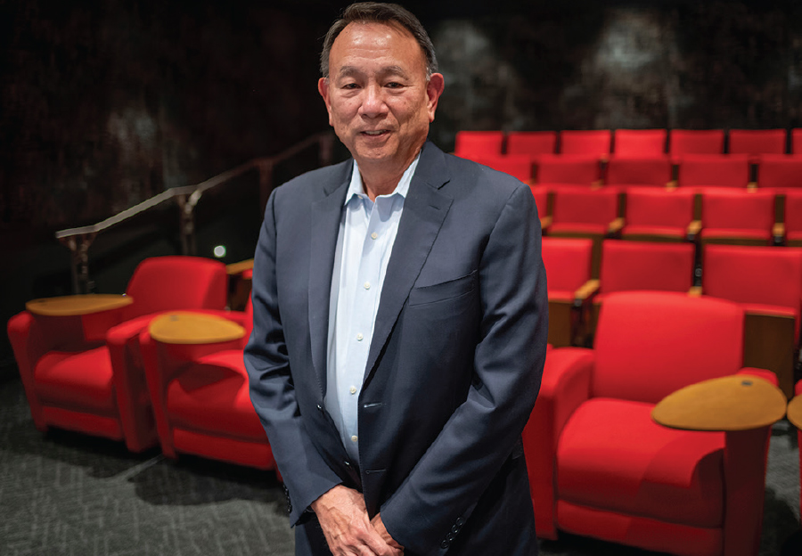 John Chen ’76 stands in the screening room that he donated
