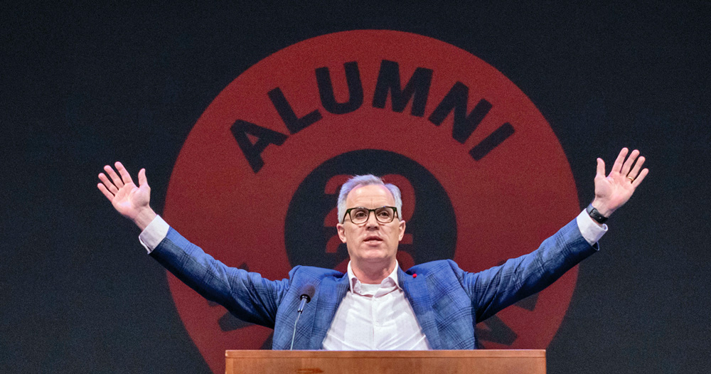 Jim Sailer ’90 speaks from a podium