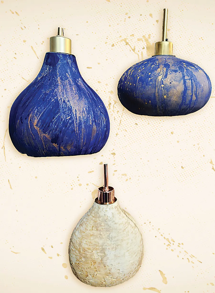 Blue and white lamps made from gourds by Petra Floyd ’12