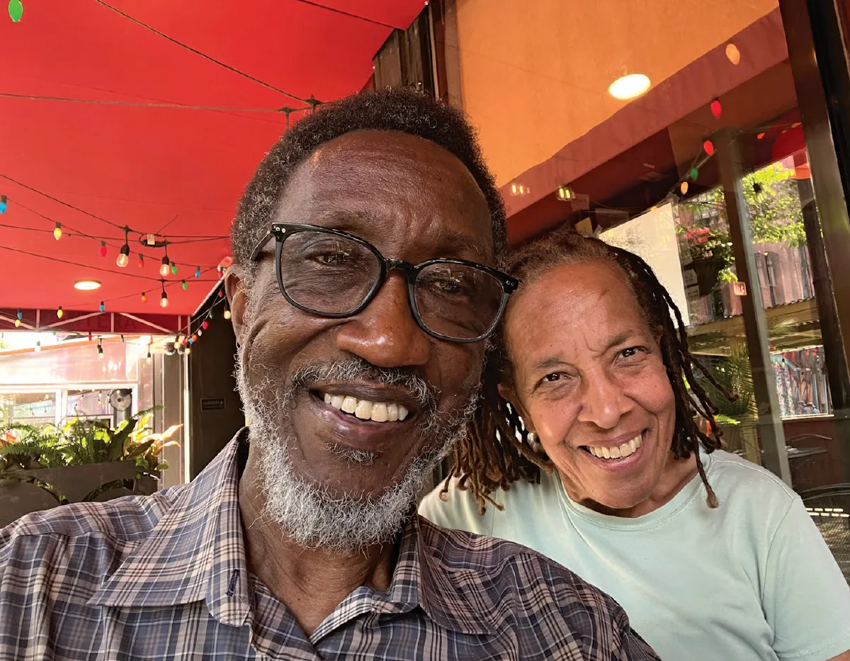 Isaac Stanley and his wife Ava Harris outside a restaurant
