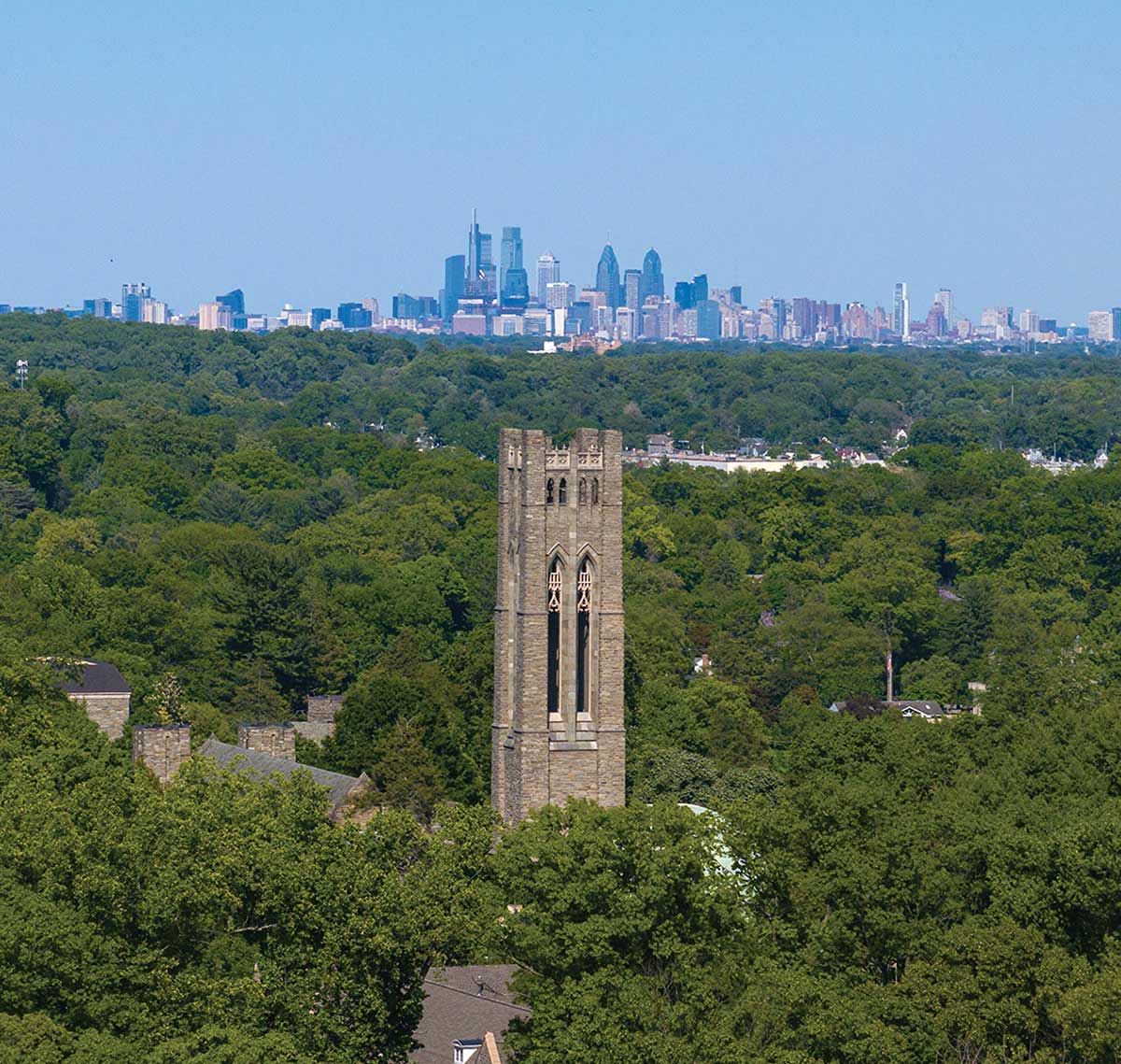 Clothier Tower, shot from above, with the Philadelphia skyline in the background.
