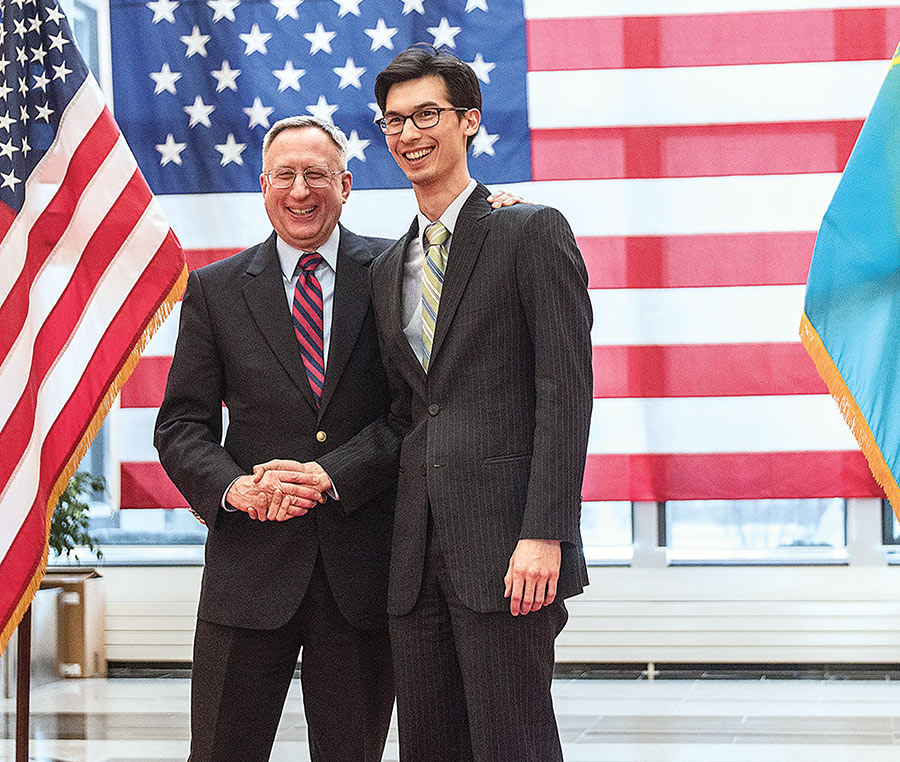 Wren Elhai '08 shakes hands with U.S. Ambassador to Kazakhstan George Krol.