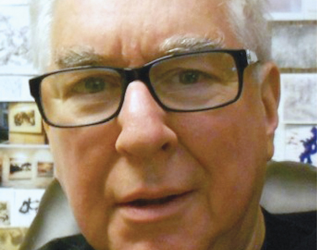 Close-up of Norman S. Sarachek '60 in glasses