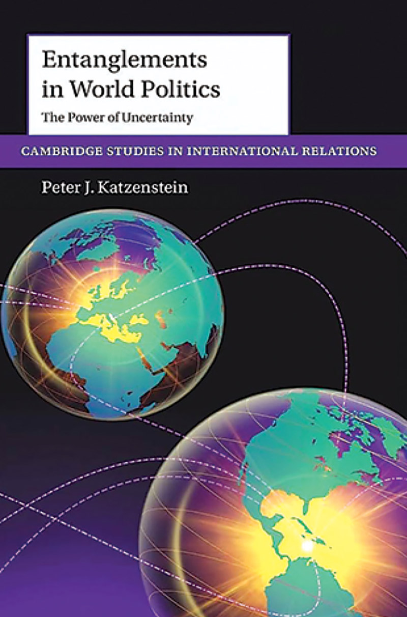 A book cover with a purple background and two globes on it.